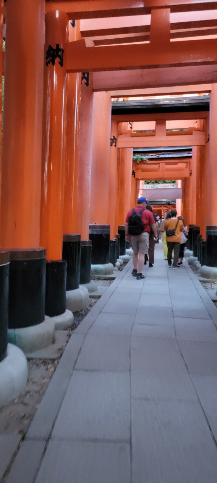 Jeff walking through the red torii gates at Fushimi Inari in Kyoto
